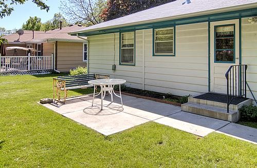 morning sun concrete patio adjacent to the back door & kitchen